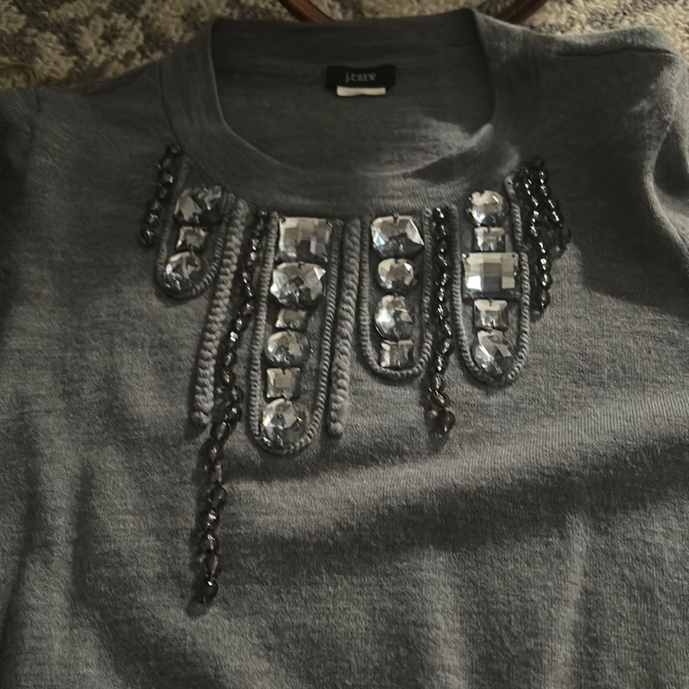 Like new never worn jeweled Crew neck long sleeve sweater